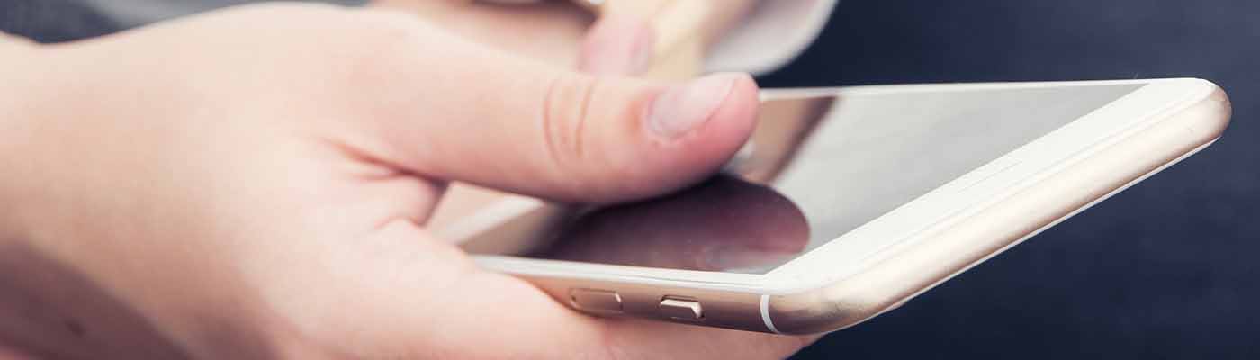 hand with cell phone mistype dobly atmos